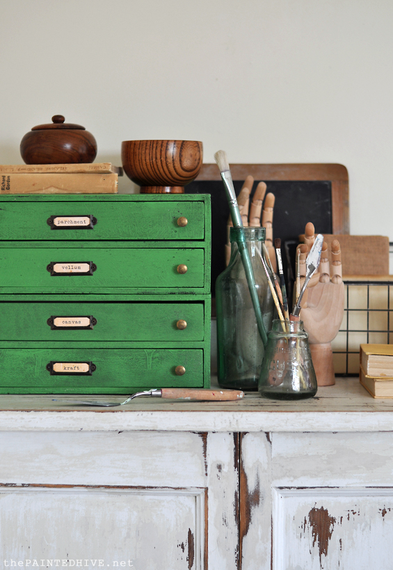 Antique dresser painted in black chalk paint, distressed and